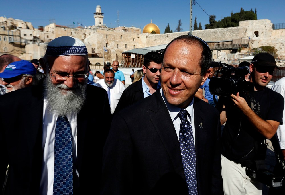 Jerusalem Mayor Nir Barkat walks after praying at the Western Wall in Jerusalem's Old City Oct. 23, 2013. (Photo by Baz Ratner/Reuters)