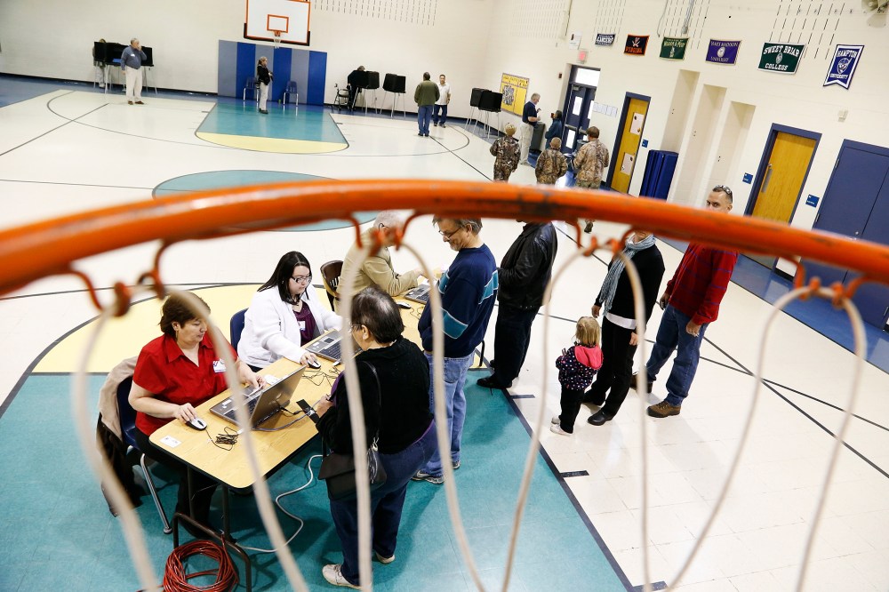 Voters check in to vote at a polling place in Spotsylvania, Virginia, Nov. 5, 2013.
