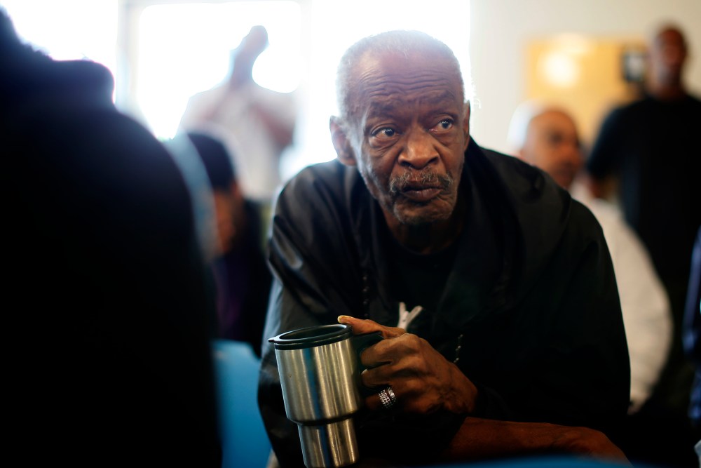 U.S. military veterans listen to speeches during a Veterans Day observance for homeless veterans at The Midnight Mission shelter on skid row in Los Angeles.
