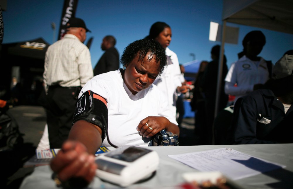 Bernita Jackson, 51, has her blood pressure measured at an event to inform people about the Affordable Care Act in Los Angeles, Nov. 25, 2013.