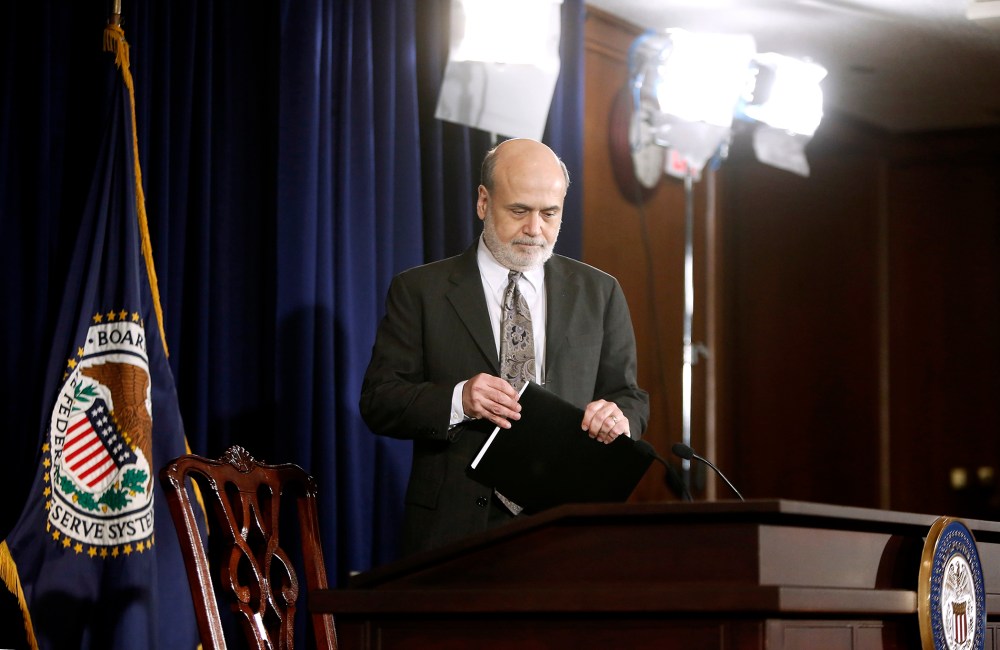 U.S. Federal Reserve Chairman Ben Bernanke takes his seat for a news conference at the Federal Reserve Bank headquarters in Washington, Dec. 18, 2013.