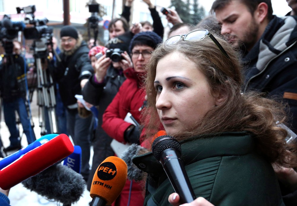Maria Alyokhina (C), member of Russian punk band Pussy Riot, speaks to the media after her release from a penal colony in Nizhny Novgorod, Russia, Dec. 23, 2013.