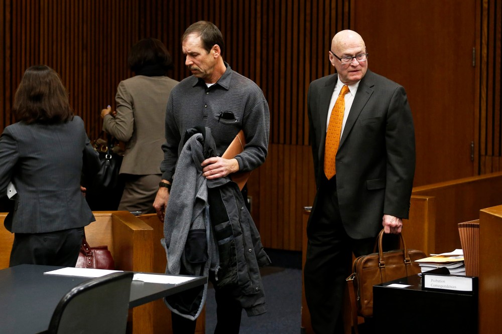 Theodore Wafer (C) and his attorneys Cheryl (L) and Mack Carpenter leave the courtroom after his arraignment in Detroit, Jan. 15, 2014.