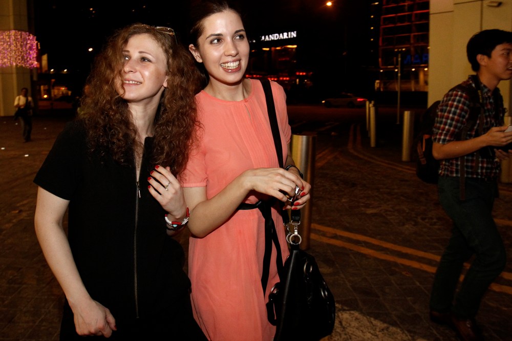 Members of Russian punk rock band Pussy Riot leave the inaugural Prudential Eye Awards in Singapore