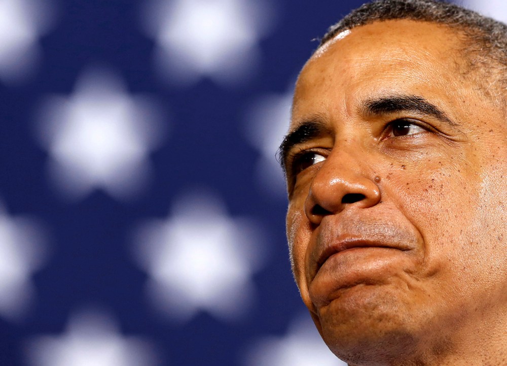 President Barack Obama pauses while he speaks at an event, Jan. 30, 2014 in Waukesha, Wis.