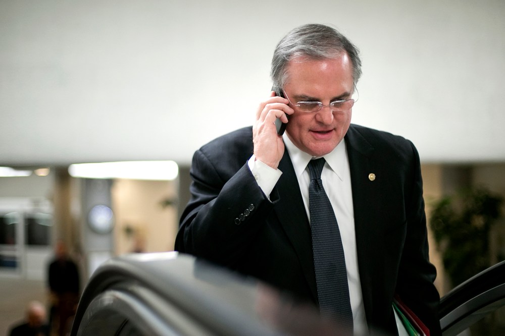 U.S. Senator Pryor talks on his mobile phone as he arrives for the weekly Democratic caucus luncheon at the U.S. Capitol in Washington