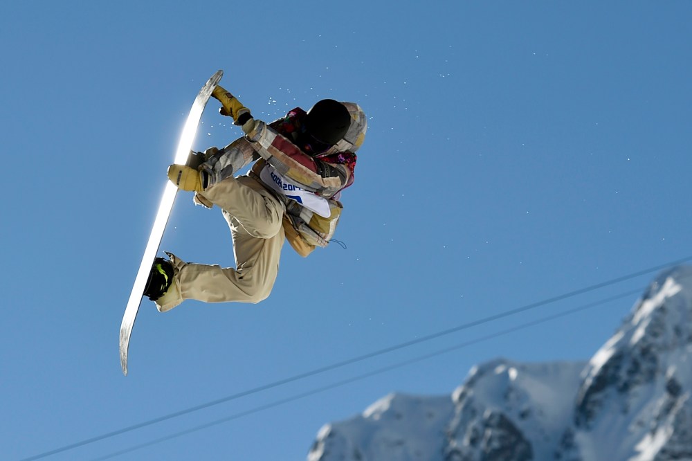 Sage Kotsenburg of the United States performs a jump during the men's snowboard slopestyle final at the 2014 Sochi Olympic Games, Feb. 8, 2014, in Rosa Khutor.