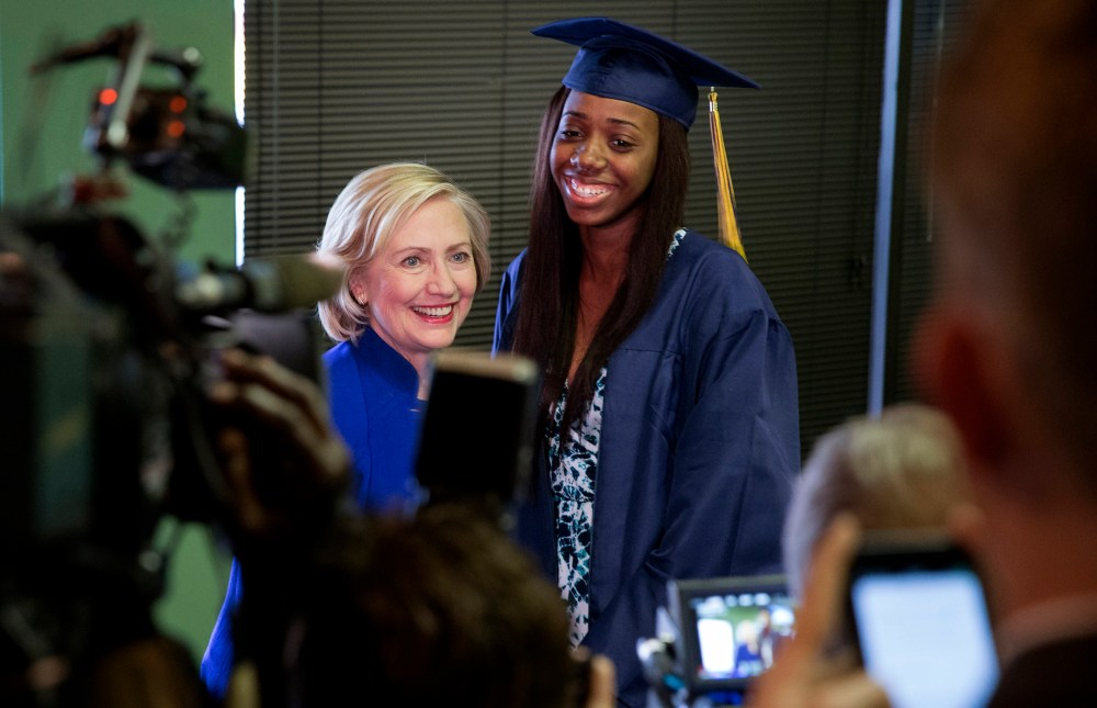 Democratic presidential candidate Hillary Clinton has her picture taken with Keenan High School graduate Dayzjohna Roberts at Kiki's Chicken and Waffles restaurant in Columbia, S.C., May 27, 2015. (Photo by Chris Aluka Berry/Reuters)