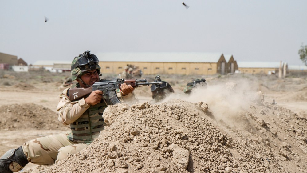 Iraqi soldiers train with members of the U.S. Army 3rd Brigade Combat Team, 82nd Airborne Division, at Camp Taji, Iraq, in this U.S. Army photo released June 2, 2015. (Photo by U.S. Army Sgt. Cody Quinn/Reuters)