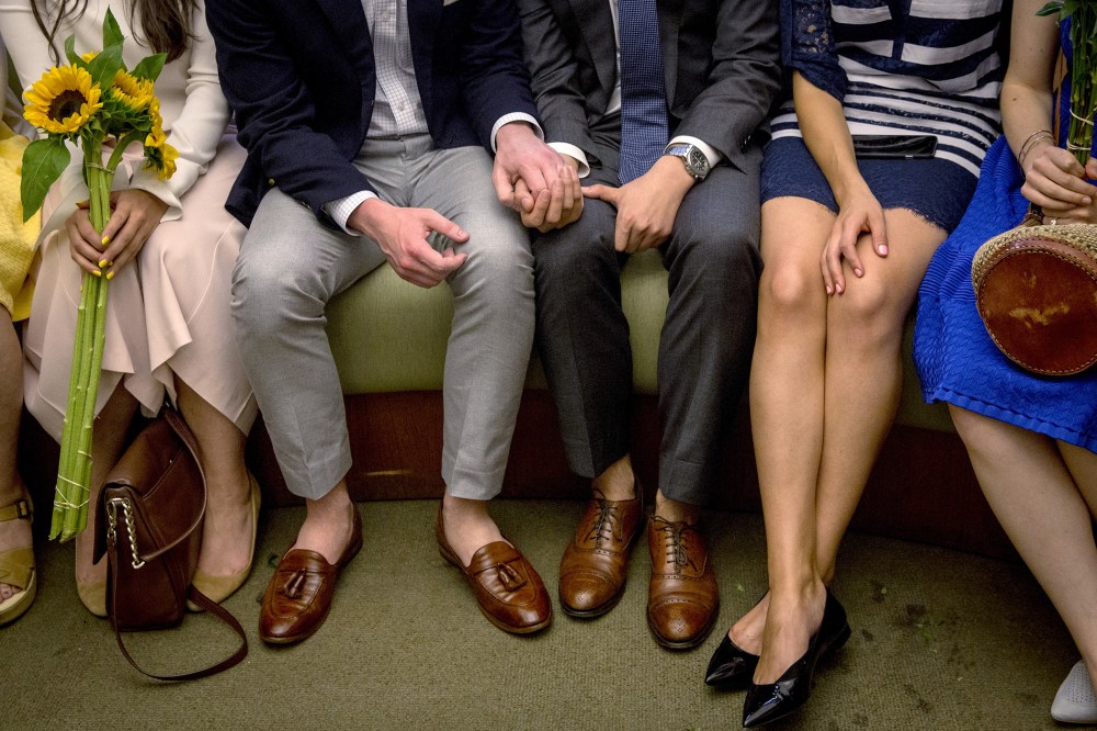 Ashby Hardesty (2nd L) and Rodrigo Zamora (C) hold hands as they wait with friends for their wedding ceremony at the New York City clerk's office in Manhattan, N.Y., June 26, 2015. (Photo by Brendan McDermid/Reuters)