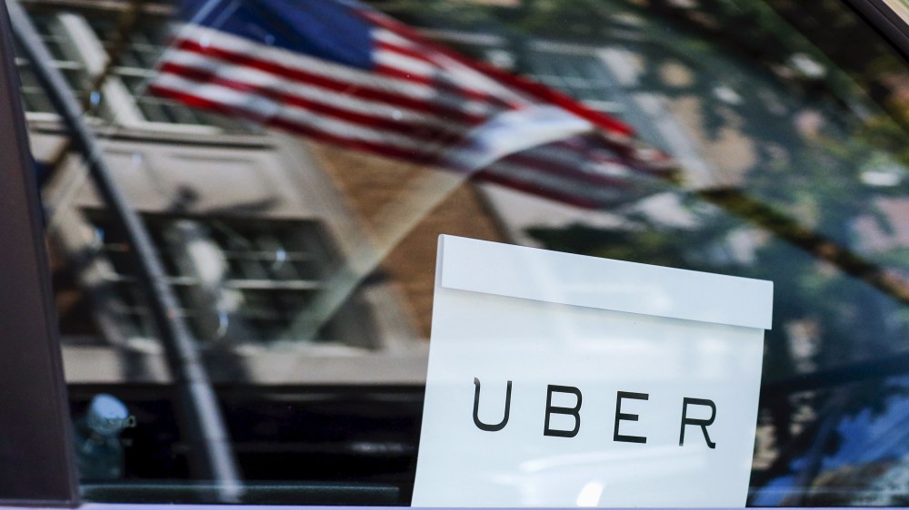 An Uber sign is seen in a car in N.Y. on June 30, 2015. (Photo by Eduardo Munoz/Reuters)