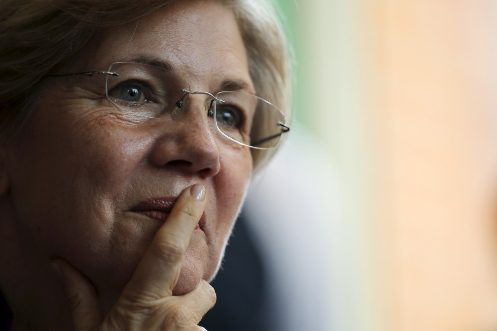 U.S. Senator Elizabeth Warren listens to workers tell their stories about erratic workplace schedules at the Equal Exchange Cafe in Boston, Mass., July 20, 2015. (Photo by Brian Snyder/Reuters)