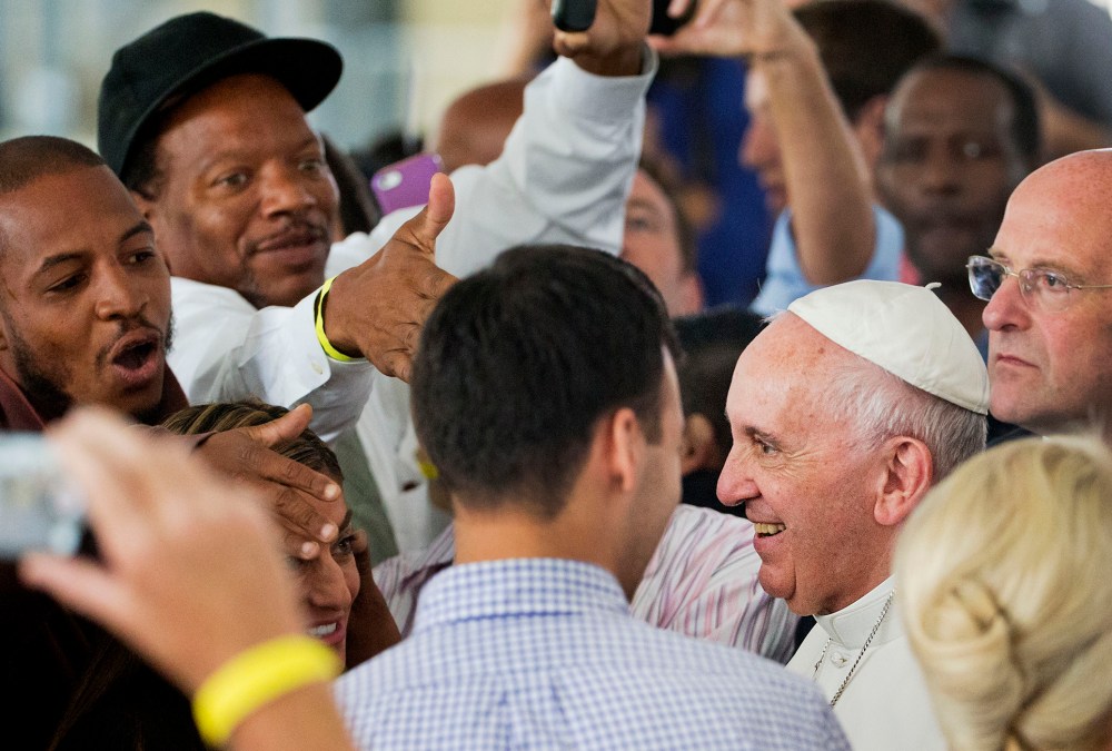 Supporters greet Pope Francis at the Catholic Charities office in Washington, Sept. 24, 2015. (Photo by Pool/Reuters)