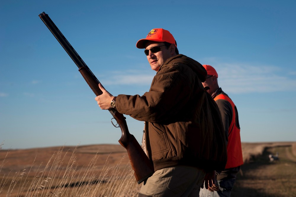 U.S. Republican presidential candidate Sen. Ted Cruz pauses before heading further down field during the Col. Bud Day Pheasant Hunt hosted by Congressman Steve King outside of Akron, Ia., Oct. 31, 2015. (Photo by Mark Kauzlarich/Reuters)