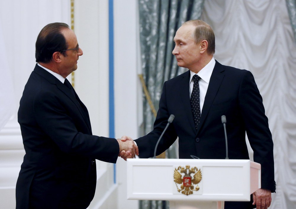 Russia's President Vladimir Putin shakes hands with his French counterpart Francois Hollande during a news conference at the Kremlin in Moscow, Russia, Nov. 26, 2015. (Photo by Sergei Chirikov/Reuters)