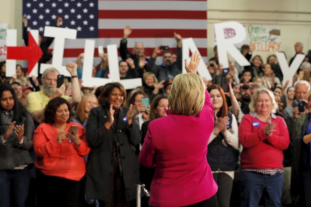 U.S. Democratic presidential candidate Hillary Clinton takes the stage for a campaign town hall meeting in Salem, N.H., Dec. 8, 2015. (Photo by Brian Snyder/Reuters)