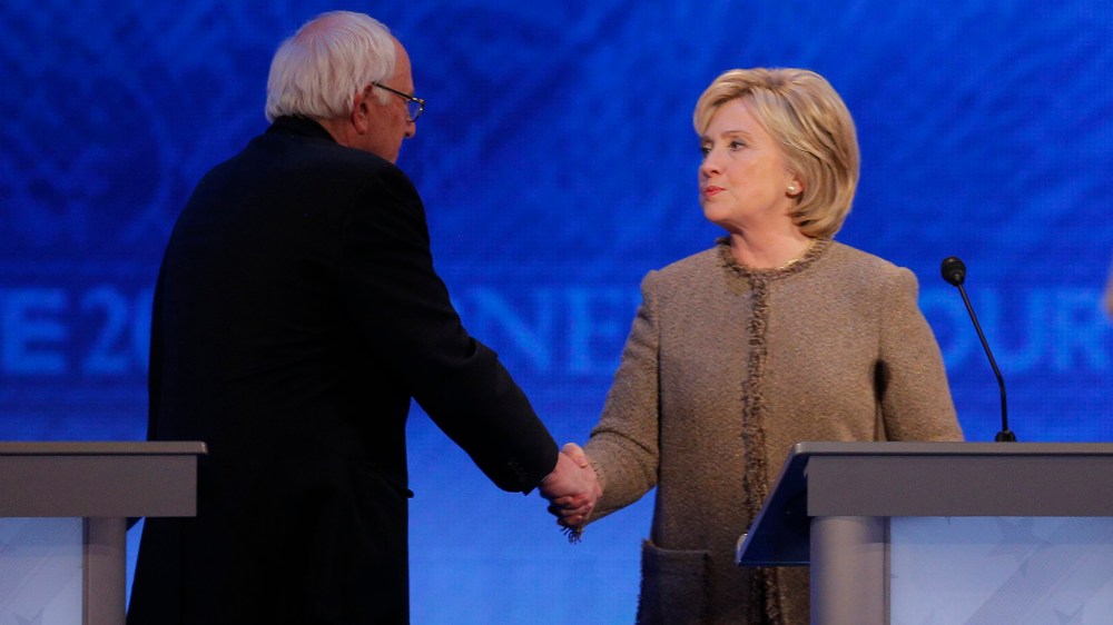 Democratic presidential candidate Senator Bernie Sanders shakes hands with rival Hillary Clinton at the conclusion of the Democratic presidential candidates debate at St. Anselm College in Manchester, N.H., Dec. 19, 2015. (Photo by Brian Snyder/Reuters)