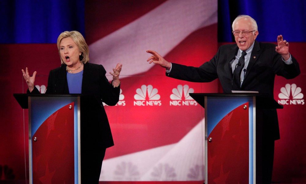 Democratic U.S. presidential candidates Hillary Clinton and Senator Bernie Sanders speak simultaneously at the NBC News - YouTube Democratic presidential candidates debate in Charleston, S.C., Jan. 17, 2016. (Photo by Randall Hill/Reuters)