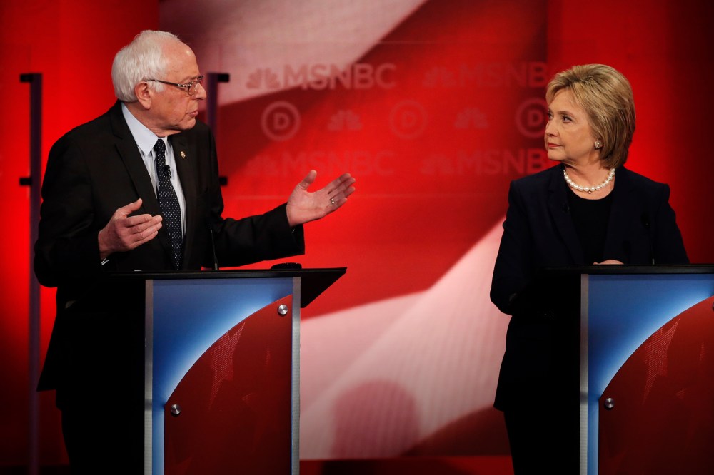 Bernie Sanders speaks as Hillary Clinton looks on as they discuss issues during the MSNBC Democratic debate at the University of New Hampshire in Durham, N.H., Feb. 4, 2016. (Photo by Mike Segar/Reuters)