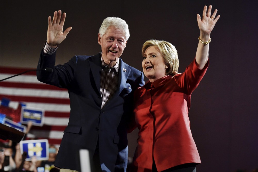 Democratic presidential candidate Hillary Clinton and her husband former President Bill Clinton wave to supporters in Las Vegas, Nev., Feb. 20, 2016. (Photo by David Becker/Reuters)