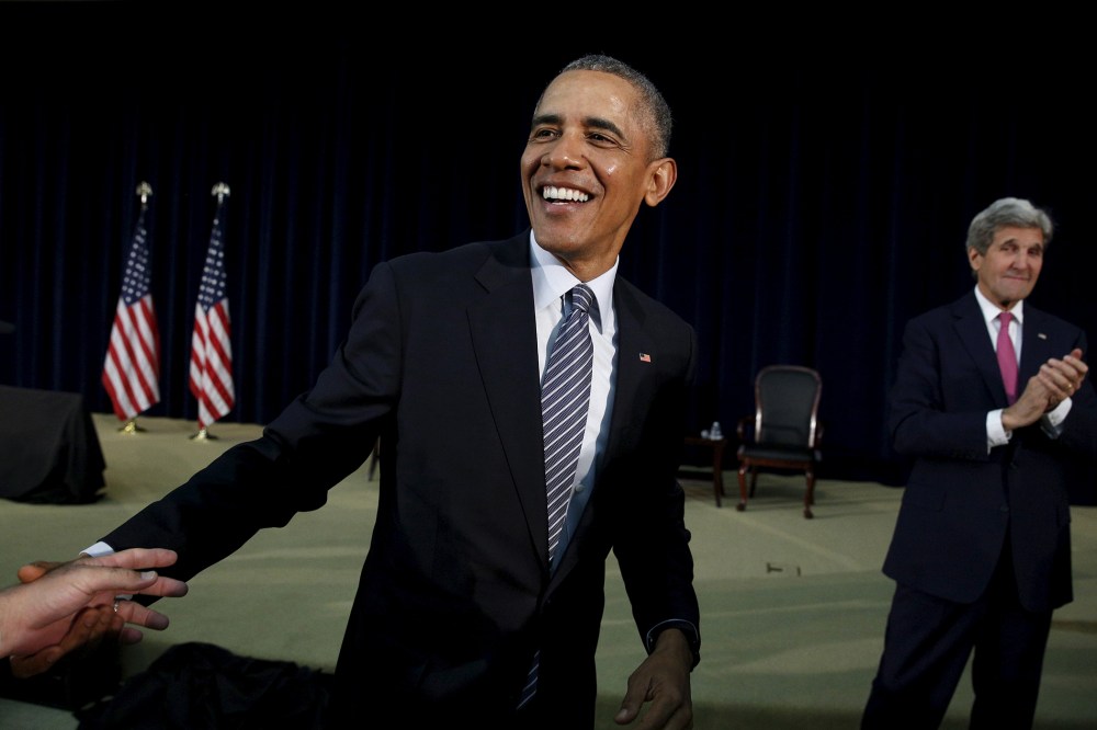 President Barack Obama smiles while greeting members of the audience after speaking at the Chief of Missions Conference at the State Department in Washington, March 14, 2016. (Photo by Kevin Lamarque/Reuters)