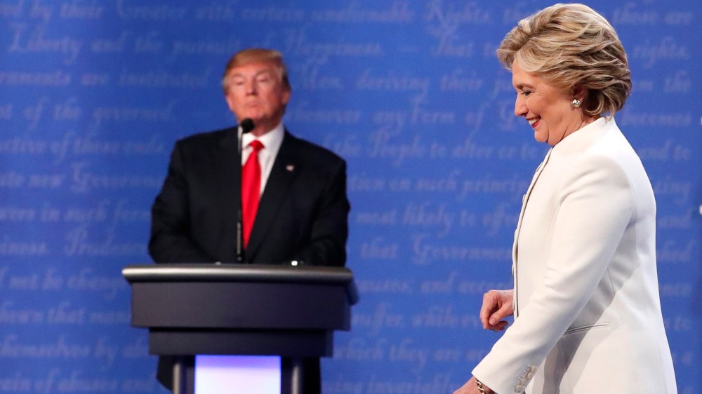 Democratic presidential nominee Hillary Clinton walks off the stage as Republican nominee Donald Trump remains at his podium after their third and final 2016 presidential campaign debate in Las Vegas, Nev., Oct. 19, 2016. (Photo by Rick Wilking/Reuters)