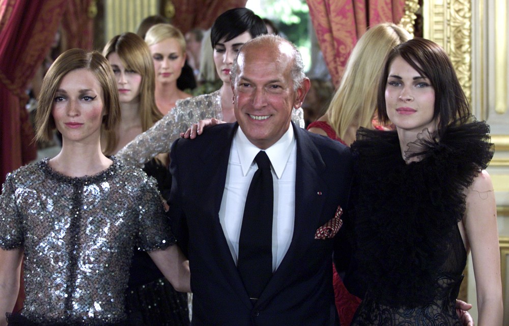 US designer Oscar de la Renta arrives at the end of the presentation of French fashion house Balmain..