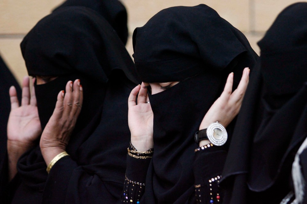 Saudi women pray during Eid al-Adha celebrations on a street in Riyadh, Nov. 27, 2009. (Photo by Stringer/Reuters)