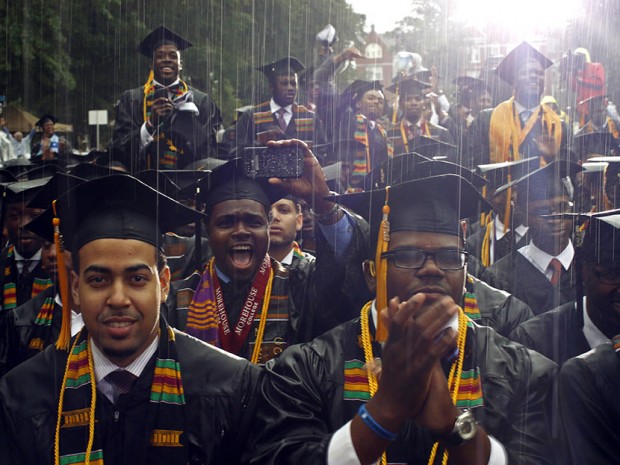 Graduates of the class of 2013 react to their commencement address given by U.S. President Obama during a spring downpour at Morehouse College in Atlanta