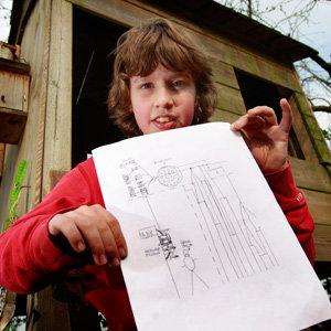 Jurre Hermans poses with the drawing he submitted at his home in the Netherlands on Tuesday.