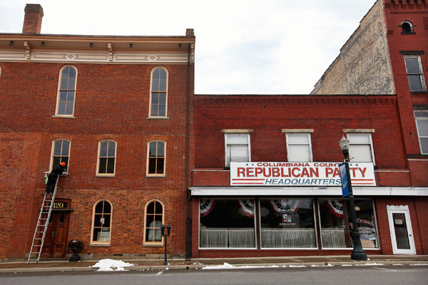 A worker cleaning windows next to Republican Party headquarters in Lisbon, Ohio.