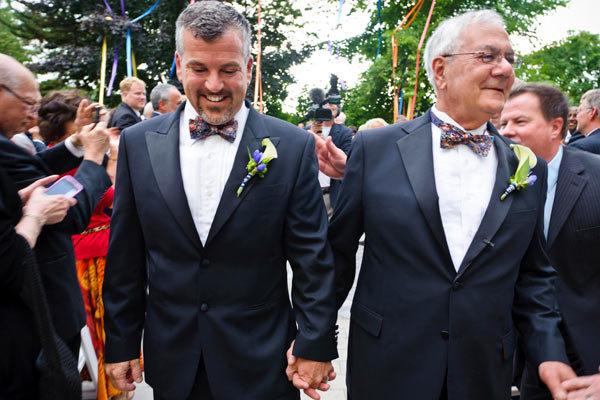 Rep. Barney Frank and Jim Ready walking back down the aisle after exchanging vows in Newton, Massachusetts on Saturday.
