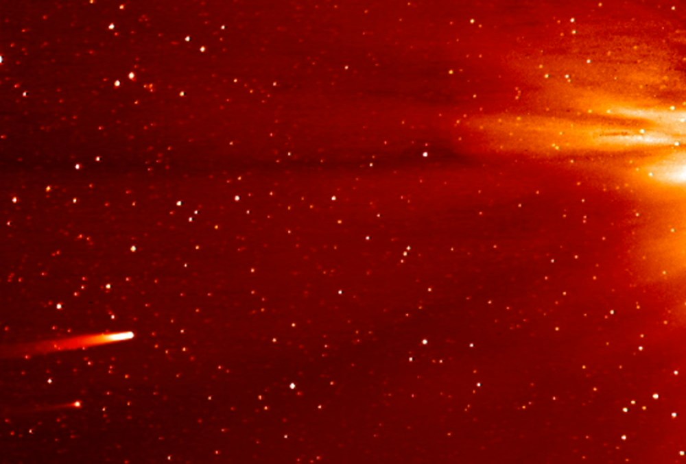 In this frame grab taken from enhanced video made by NASA's STEREO-A spacecraft, comet ISON, left, approaches the sun on Nov. 25, 2013.