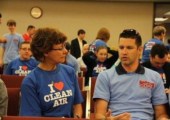 Only one of these people is being paid to be there.