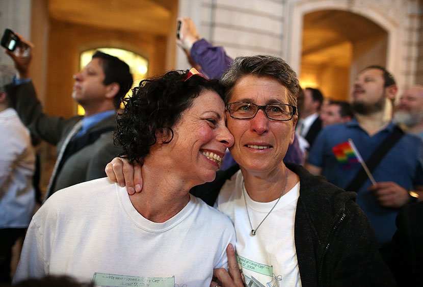 Same-sex couple Sue Rochman (L) and Robin Romdalvik celebrate upon hearing the U.S. Supreme Court's rulings on gay marriage in City Hall June 26, 2013 in San Francisco, United States. The high court struck down the Defense of Marriage Act (DOMA) and...