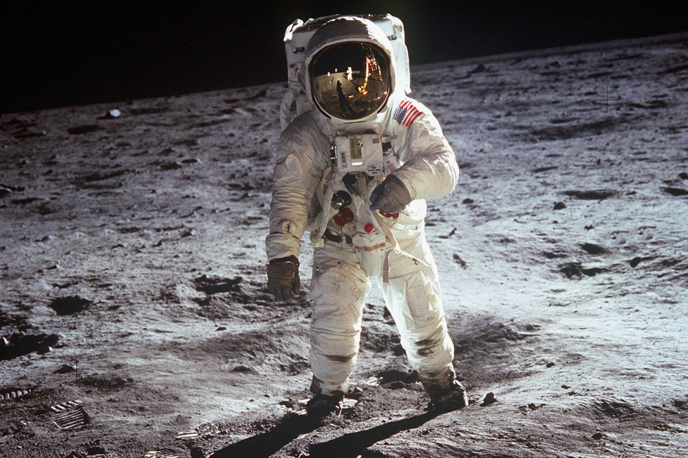 American astronaut Edwin "Buzz" Aldrin walking on the moon on July 20, 1969 during Apollo 11 mission. Neil Armstrong's reflection in the visor of the helmet. (Photo by Apic/Getty Images)