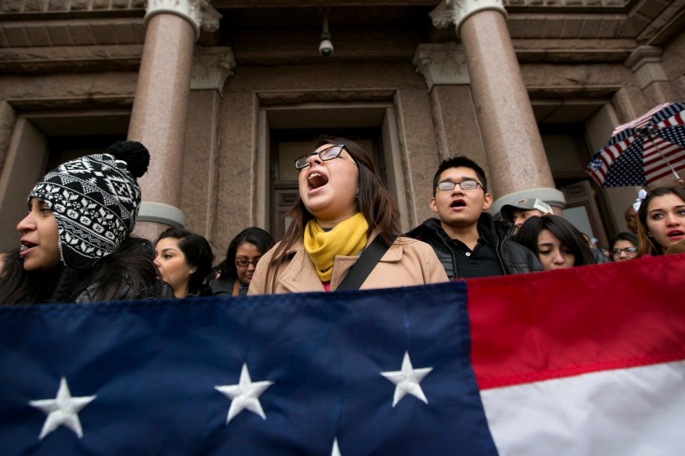 Maria Yolisma Garcia, 20, of Dallas, center, rallies in support of the HB1403, the Texas DREAM Act, at a demonstration at the Capitol in Austin, Texas, on Jan. 14, 2015. (Photo by Jay Janner/Austin American-Statesman/AP)