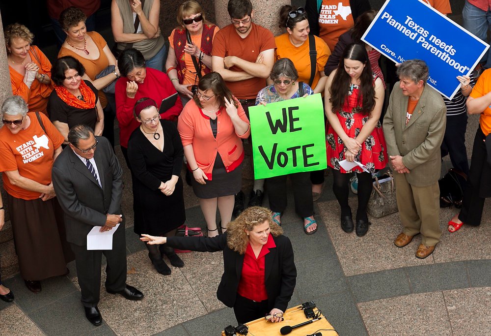 Various Texas legislators, including Rep. Donna Howard, gathered in the open-air rotunda to show their support for Women's Health issues and concerns at the Texas State Capitol Thursday, Feb. 20, 2014.