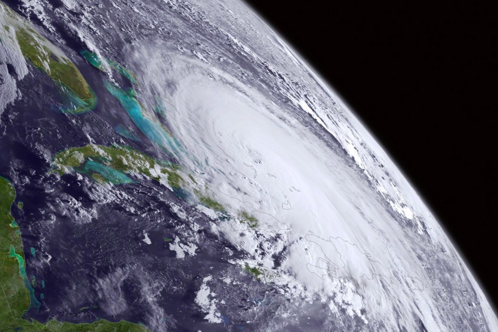An already colossal Hurricane Joaquin swirls in this satellite image taken Oct. 1, 2015 at 8 a.m. EDT. (Photo by NOAA/AP)