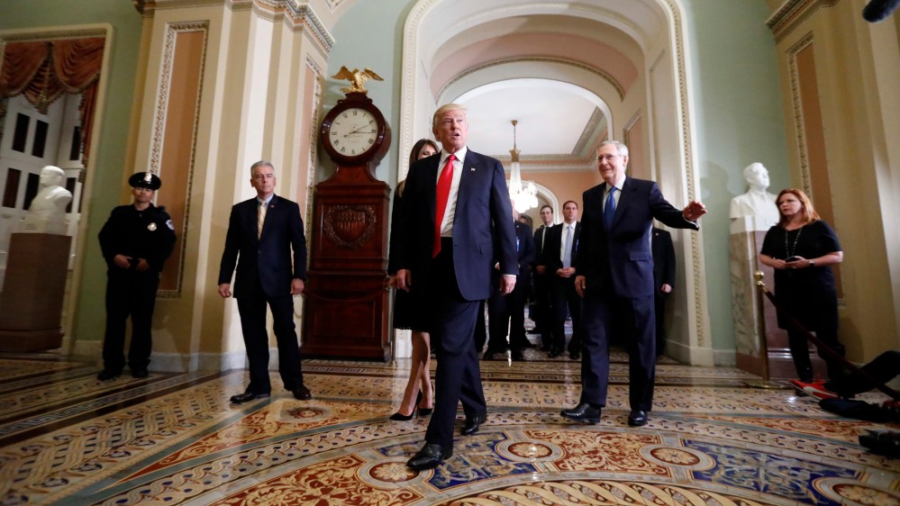 President-elect Donald Trump and his wife Melania Trump walk with Senate Majority Leader Mitch McConnell of Ky. on Capitol Hill, Nov. 10, 2016, in Washington, D.C. (Photo by Alex Brandon/AP)