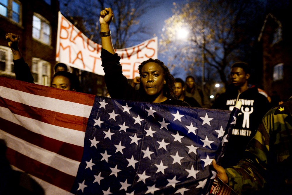 Demonstrators shout slogans during a march in St. Louis, Missouri, on Nov. 23, 2014 to protest the death of 18-year-old Michael Brown.