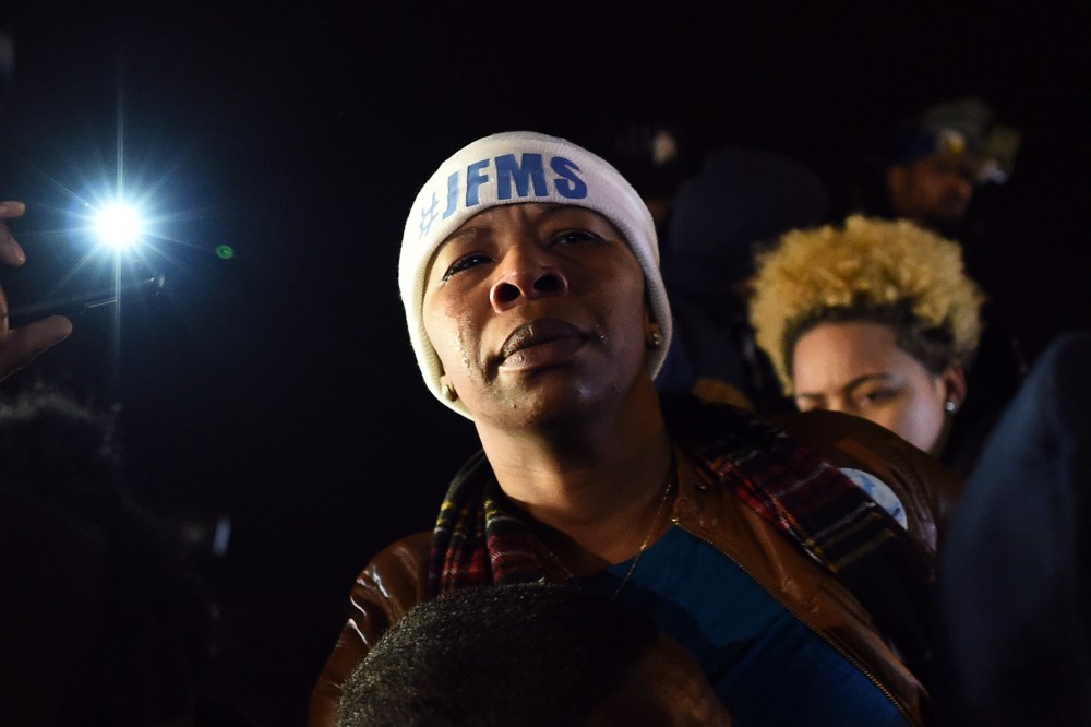 Michael Brown's mother Leslie McSpadden cries outside the police station in Ferguson, Mo. on Nov. 24, 2014 after hearing the grand jury decision on her son's fatal shooting