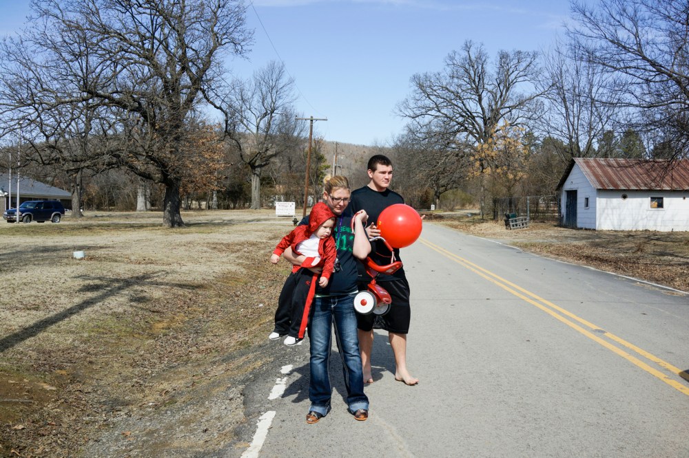 Autumn and Mike Sisco with their son Bobby in Quinton, Okla. Autumn and Mike had their son when she was 17 and he was 15.