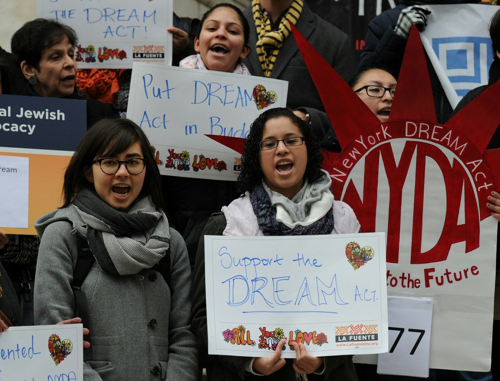 Immigration activists rally on the the steps of the New York Public Library January 13, 2014 in New York.