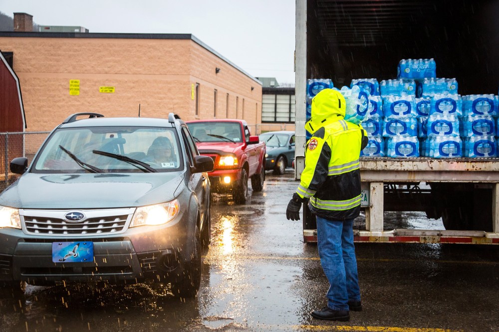 Lines formed early Saturdayas local residents in Kanawha County (W.Va.) flocked to distribution centers to load up on bottled water, Jan. 11, 2014.