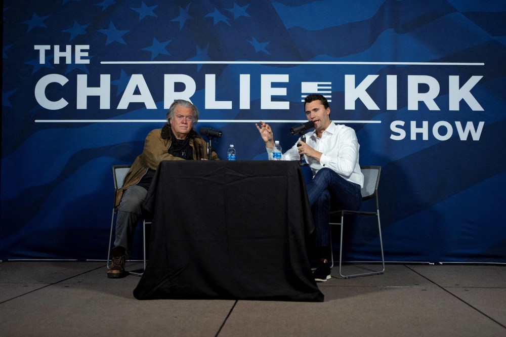 Charlie Kirk conducts a live podcast with Steve Bannon during the AmericaFest 2024 conference  in Phoenix, Ariz., on Dec. 19, 2024.