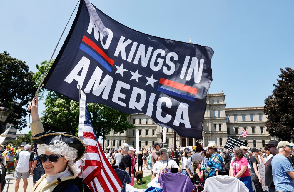 People take part in a "No Kings" protest.