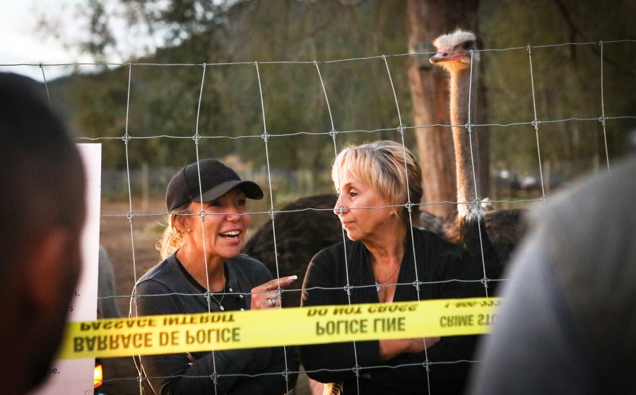 Karen Espersen, right, the co-owner of Universal Ostrich Farms, speaks with supporters with her daughter, Katie Pasitney, at the farm.