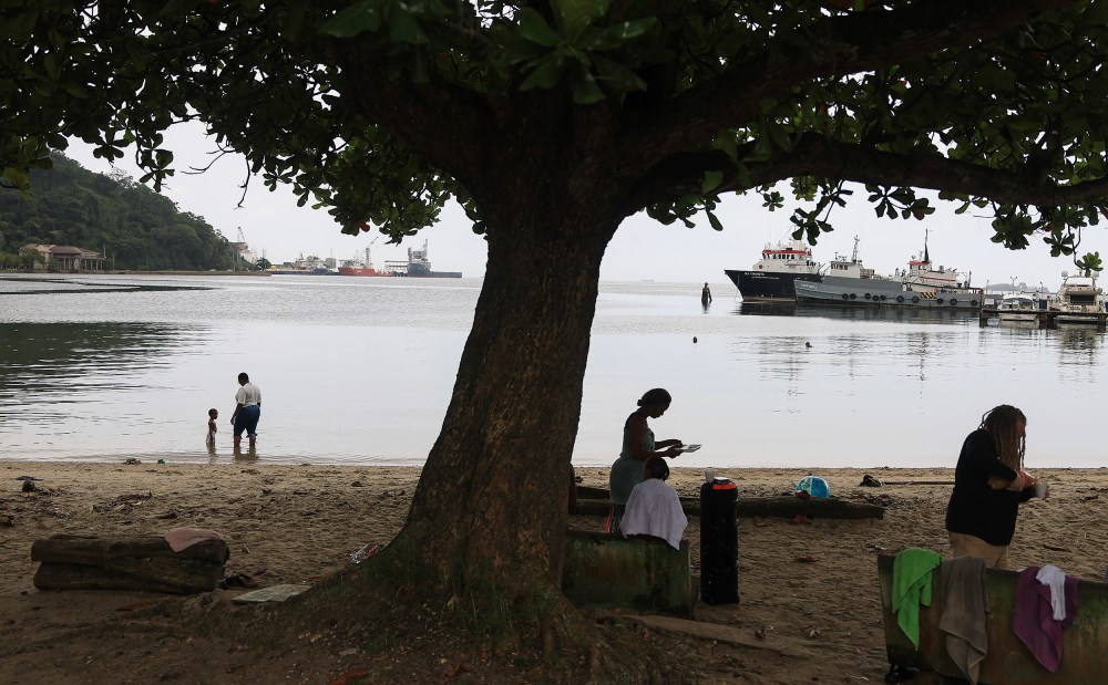 People along the Gulf of Paria in Port of Spain, Trinidad and Tobago.