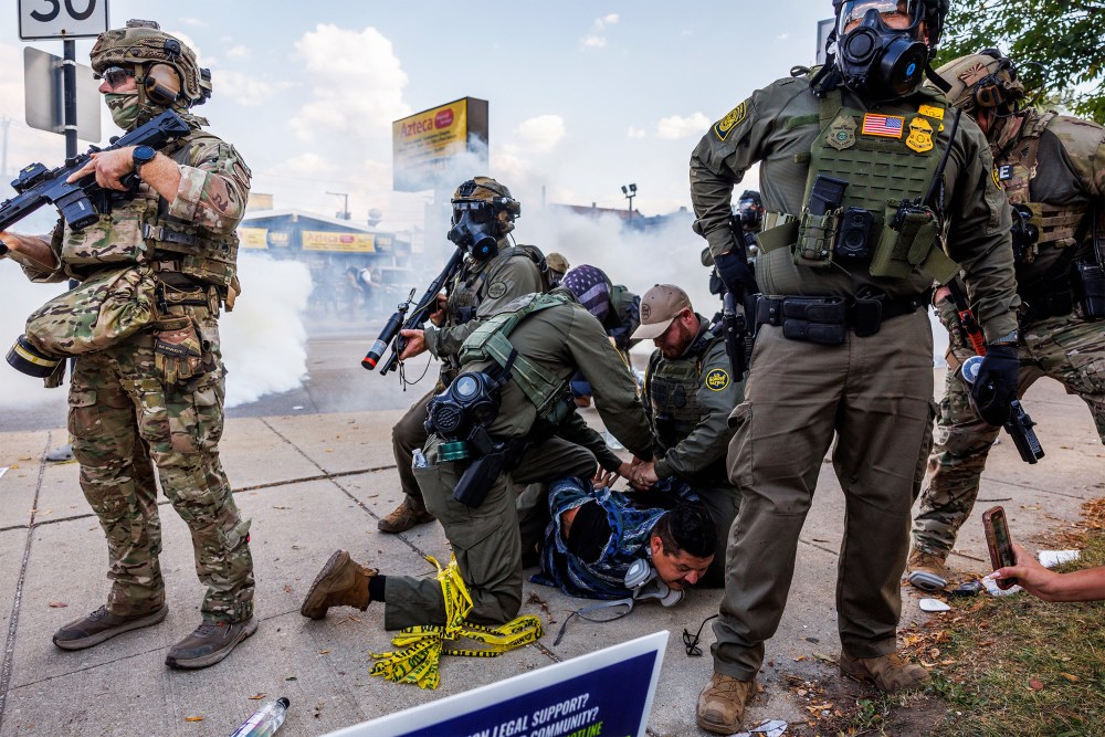 Federal officers detain a person in Chicago, IL.
